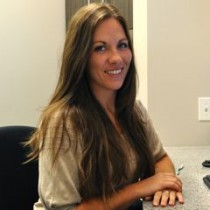 Dental Treatment Care Coordinator at Aesthetic & Implant Dentistry of Atlanta preparing to assist a dental patient